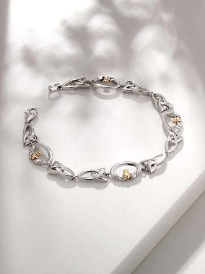 Claddagh bracelet in sterling silver with 10K gold heart and crown, featuring Trinity Knot link design.