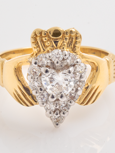14K Gold Claddagh Ring featuring the iconic hands, heart, and crown design, with a brilliant diamond at the center, crafted in radiant gold.