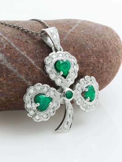Elegant 14K white gold shamrock pendant with emerald and diamond accents